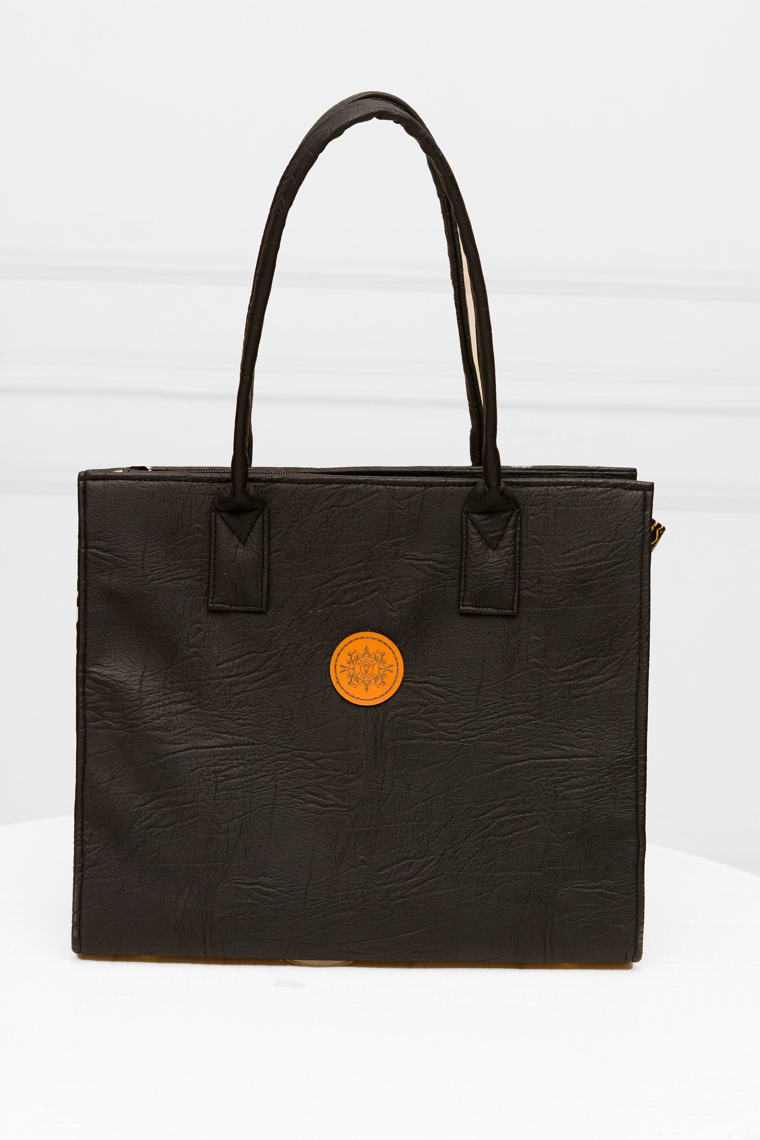 Handmade Black Soft Leather and Ankara/ African print mid-sized handbag.