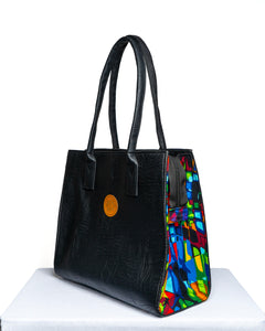 Handmade Black Soft Leather and Ankara/ African print mid sized handbag.