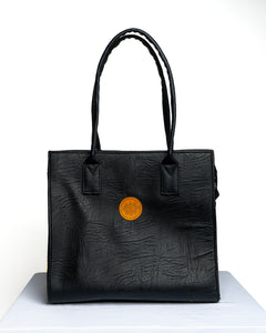 Handmade Black Soft Leather and Ankara/ African print mid sized handbag.