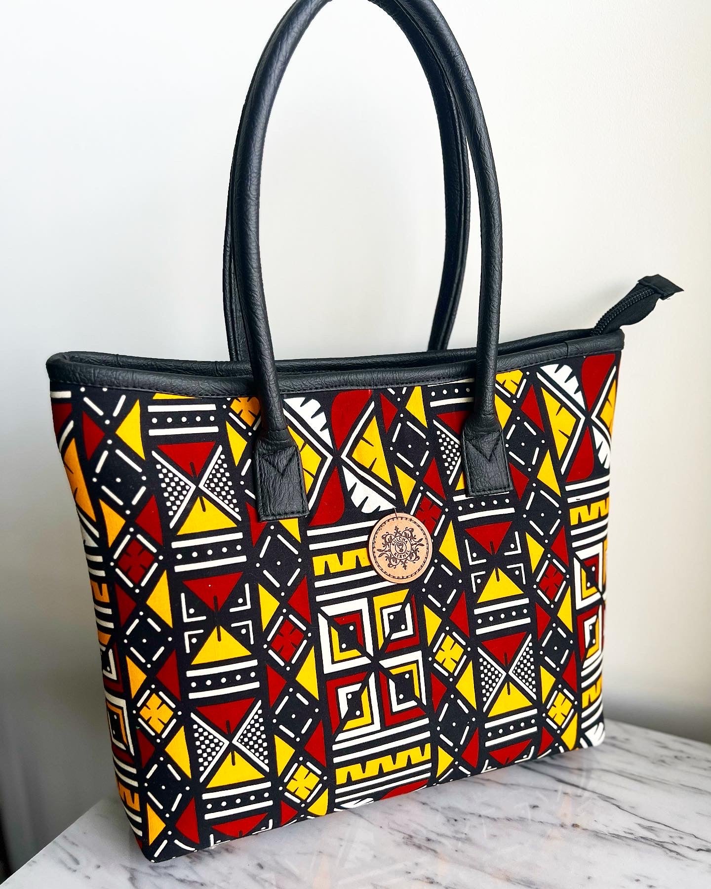Ankara/ African print mid sized handbag with Laptop carry pouch.